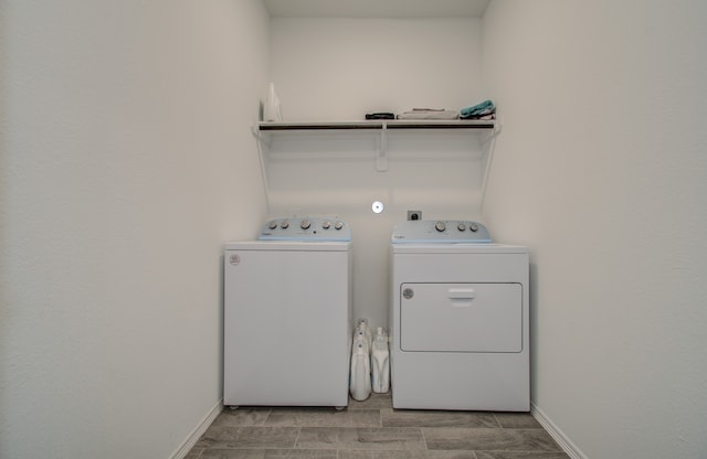 washroom with washing machine and dryer