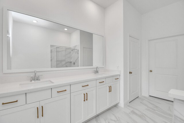 bathroom featuring vanity and an enclosed shower