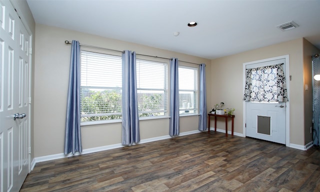 empty room featuring dark wood-type flooring