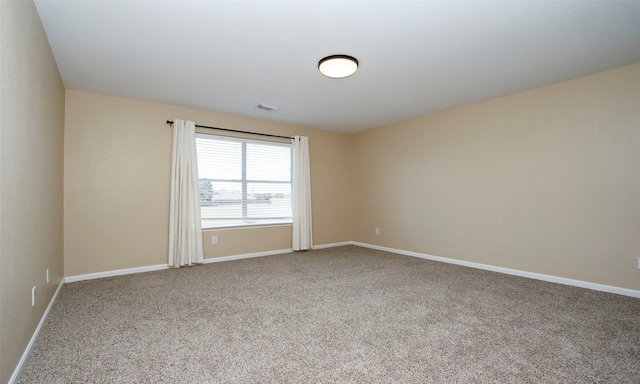 unfurnished room with carpet floors