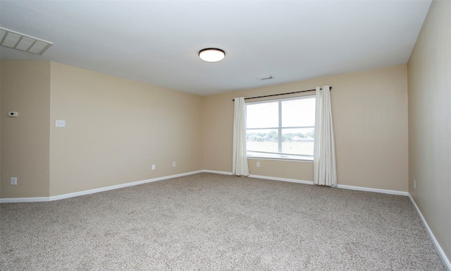 unfurnished room featuring carpet flooring