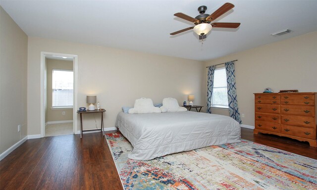 bedroom featuring ceiling fan and dark hardwood / wood-style floors