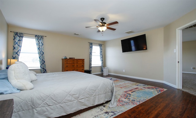 bedroom featuring ceiling fan and dark hardwood / wood-style flooring