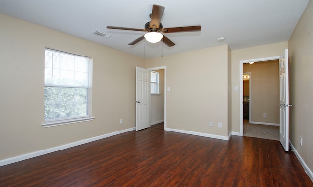 unfurnished bedroom with dark hardwood / wood-style flooring and ceiling fan