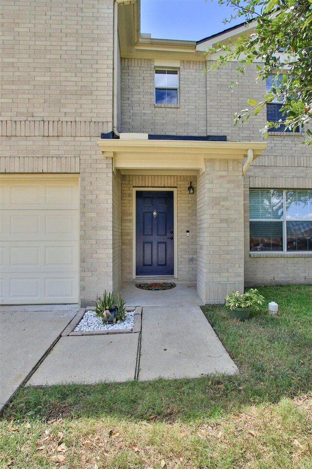 entrance to property featuring a garage