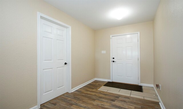 entrance foyer featuring dark hardwood / wood-style flooring