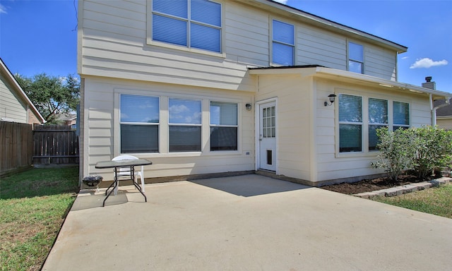 rear view of house with a patio