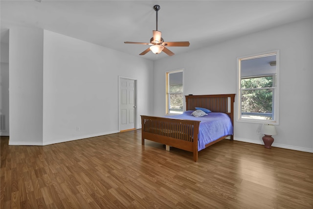 bedroom with wood-type flooring and ceiling fan