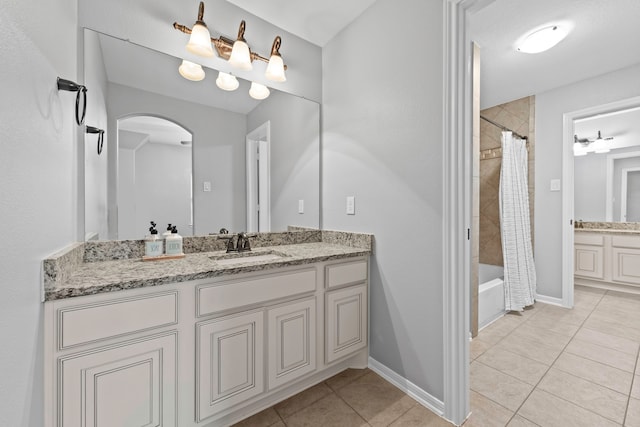 bathroom featuring shower / bath combination with curtain, tile patterned flooring, and vanity