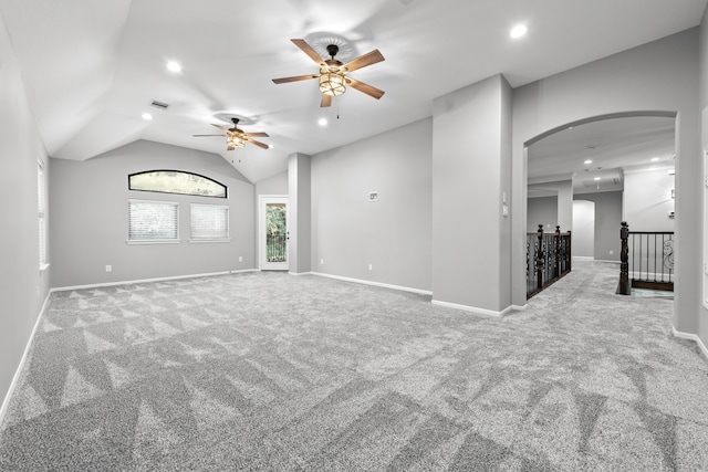 spare room featuring vaulted ceiling, ceiling fan, and carpet floors