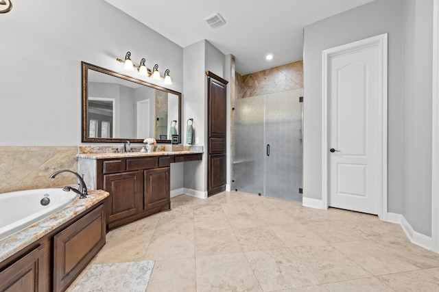 bathroom featuring shower with separate bathtub, tile patterned floors, and vanity