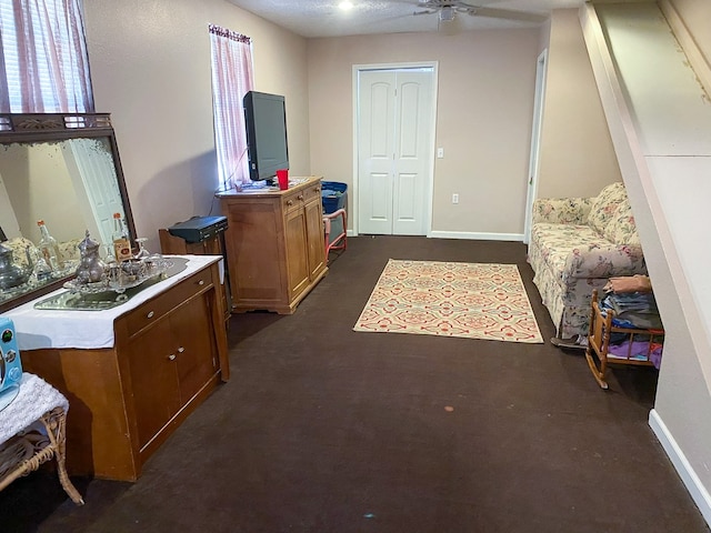 bedroom with dark carpet and ceiling fan