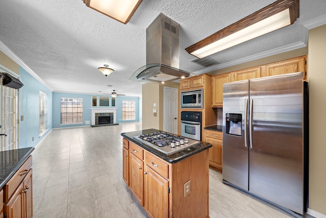 kitchen with a center island, extractor fan, a textured ceiling, and appliances with stainless steel finishes