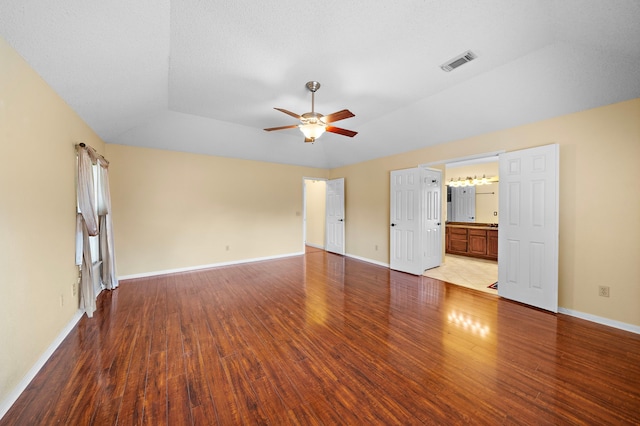 interior space featuring ceiling fan, light wood-type flooring, and a textured ceiling