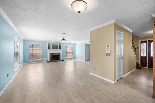 unfurnished living room with a fireplace, crown molding, and a textured ceiling