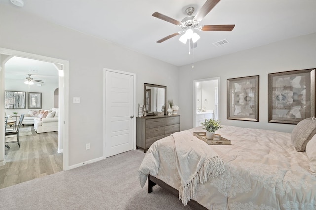 carpeted bedroom featuring connected bathroom and ceiling fan