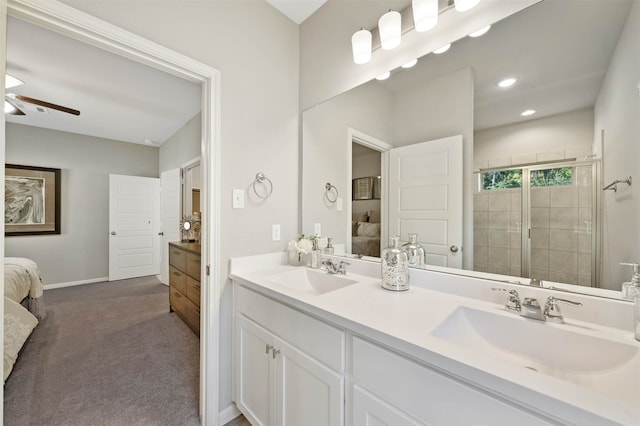 bathroom featuring ceiling fan, a shower, and vanity