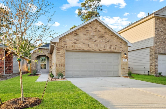 view of property with a garage and a front lawn