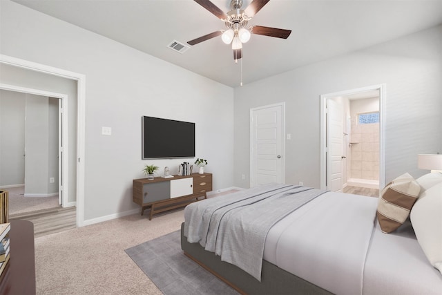 bedroom with connected bathroom, ceiling fan, and light colored carpet