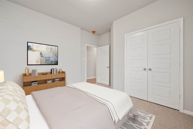 carpeted bedroom featuring a closet