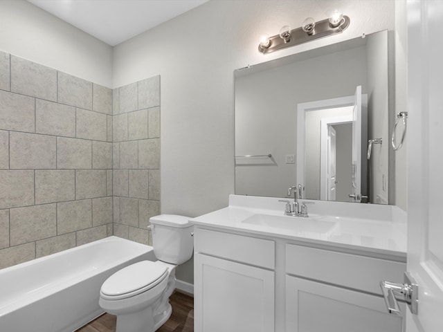 full bathroom featuring vanity, toilet, tiled shower / bath combo, and wood-type flooring