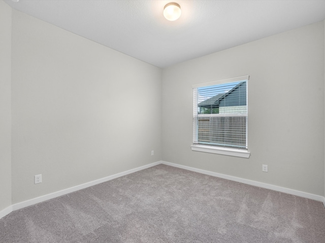 empty room with carpet flooring