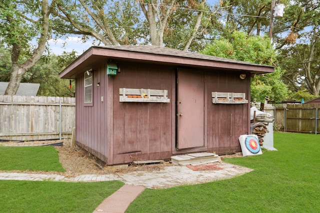 view of outdoor structure with a lawn