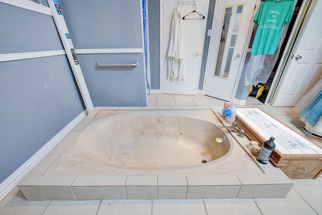 bathroom featuring tiled tub