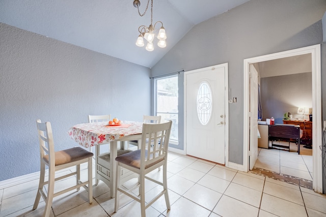 dining space with a notable chandelier, vaulted ceiling, and light tile patterned floors