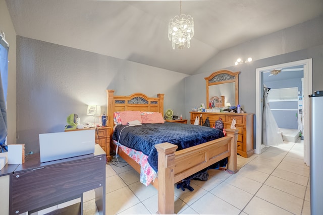 tiled bedroom featuring a chandelier, vaulted ceiling, and a walk in closet