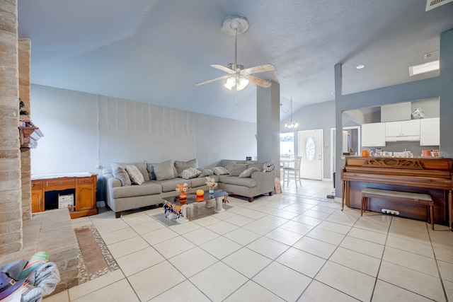 tiled living room featuring ceiling fan with notable chandelier and lofted ceiling