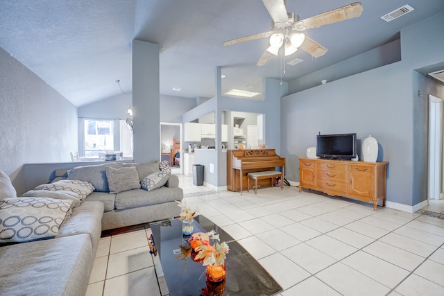 tiled living room with lofted ceiling and ceiling fan