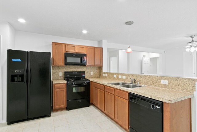 kitchen featuring sink, kitchen peninsula, decorative backsplash, black appliances, and ceiling fan