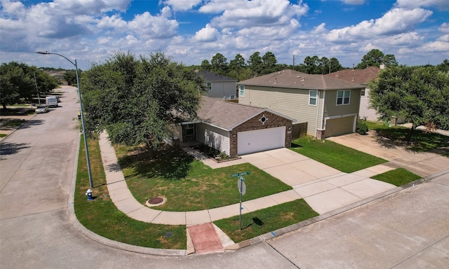 view of front of home with a front lawn and a garage