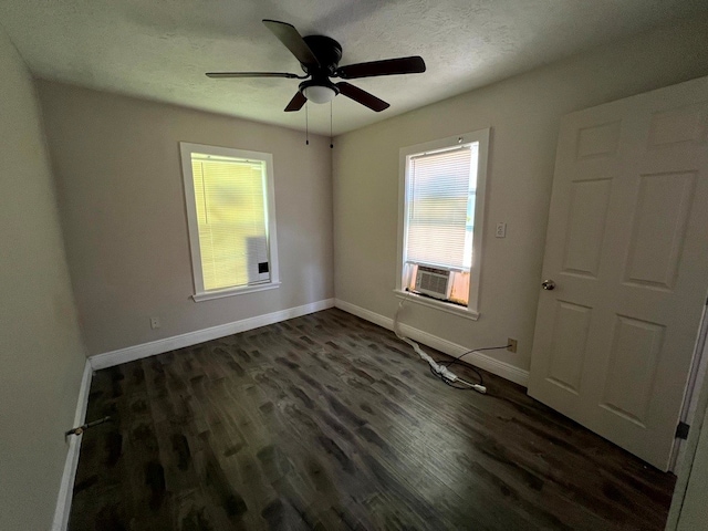 unfurnished room with dark wood-type flooring, ceiling fan, a textured ceiling, and cooling unit