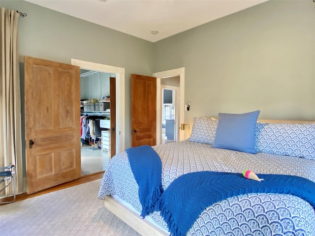 bedroom with a closet and a spacious closet