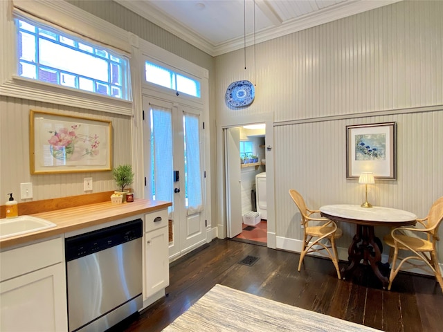 kitchen featuring dark hardwood / wood-style floors, wood counters, white cabinets, ornamental molding, and stainless steel dishwasher