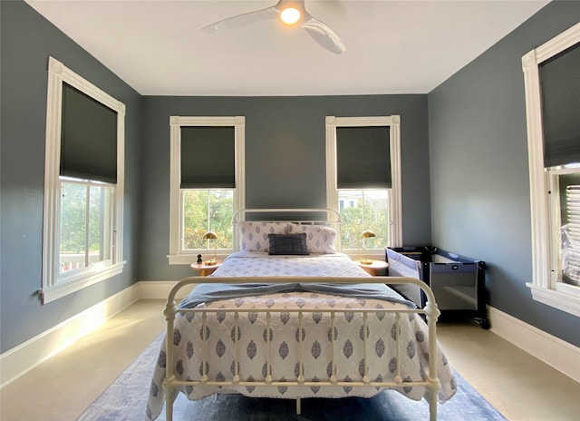 bedroom featuring baseboards and a ceiling fan
