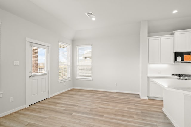 unfurnished dining area with light hardwood / wood-style flooring