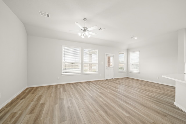 unfurnished living room featuring ceiling fan and light wood-type flooring