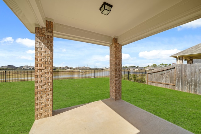 view of patio with a water view