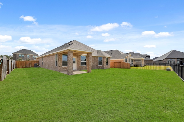 back of property featuring a yard and a patio area