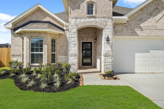 property entrance with a yard and a garage