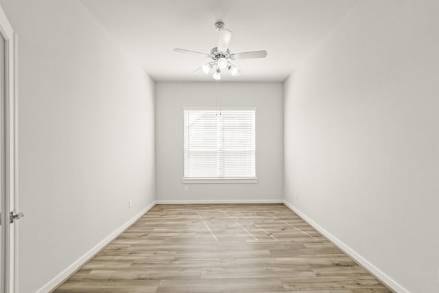 spare room with light hardwood / wood-style floors and ceiling fan