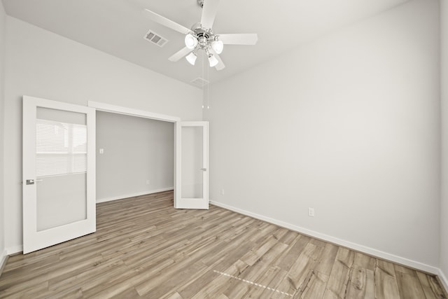 unfurnished bedroom featuring light wood-type flooring and ceiling fan