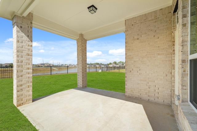 view of patio featuring a water view