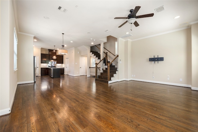 unfurnished living room with crown molding, dark hardwood / wood-style floors, and ceiling fan