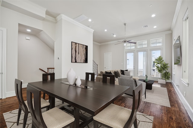 dining area featuring french doors, ceiling fan, dark hardwood / wood-style flooring, and ornamental molding