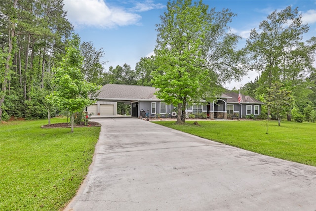 view of front of house with a garage and a front yard