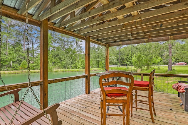 sunroom / solarium with a water view